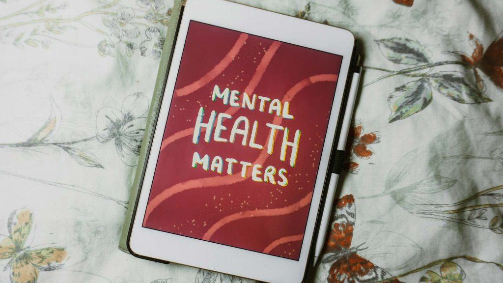 A white tablet with a graphic drawn on it that says “Mental Health Matters”. 