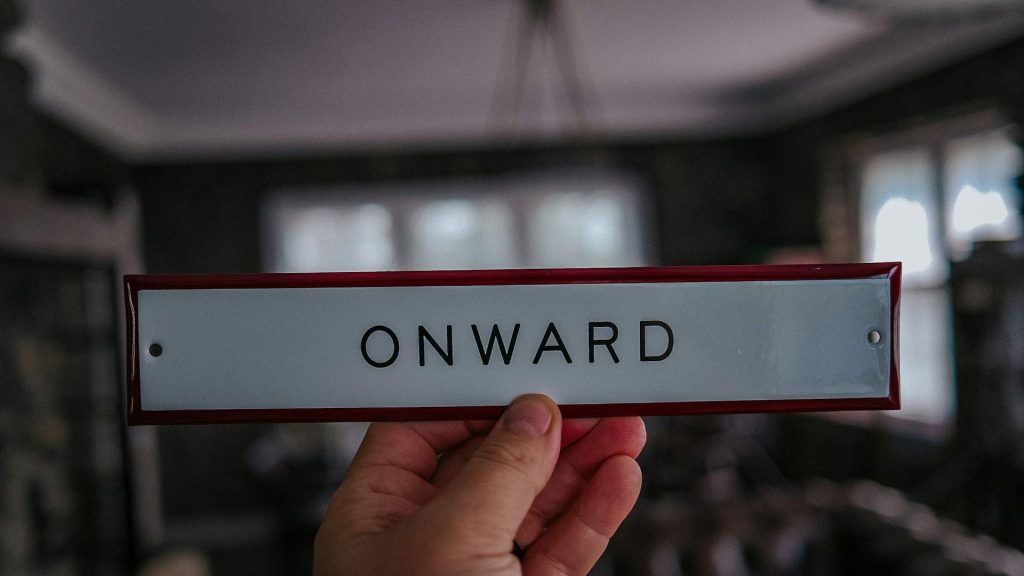 A plaque says “Onward”