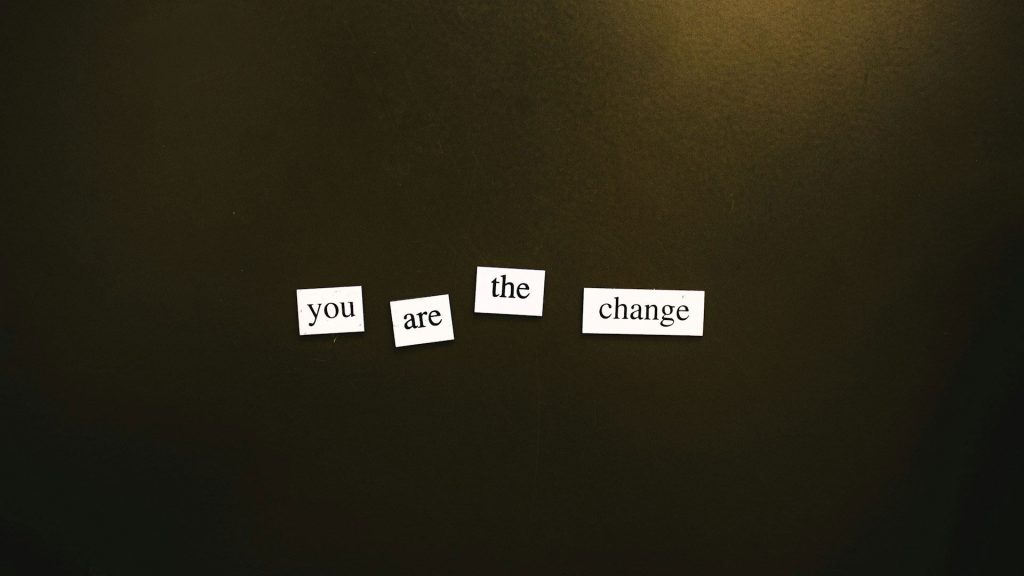 "You are the change" is displayed using white magnets.