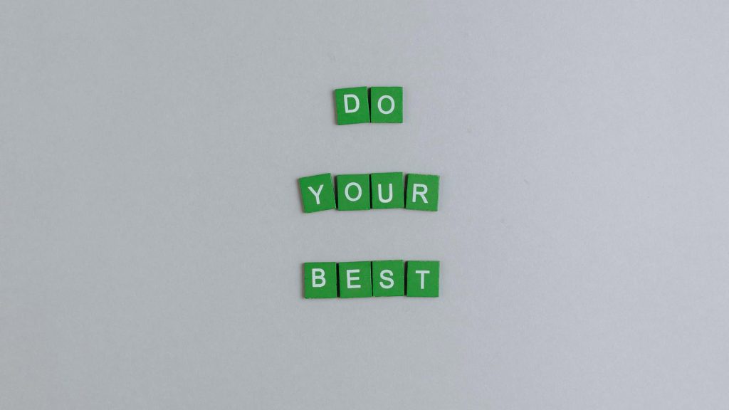 Green tiles with white letters on them spell out the phrase "Do your best."