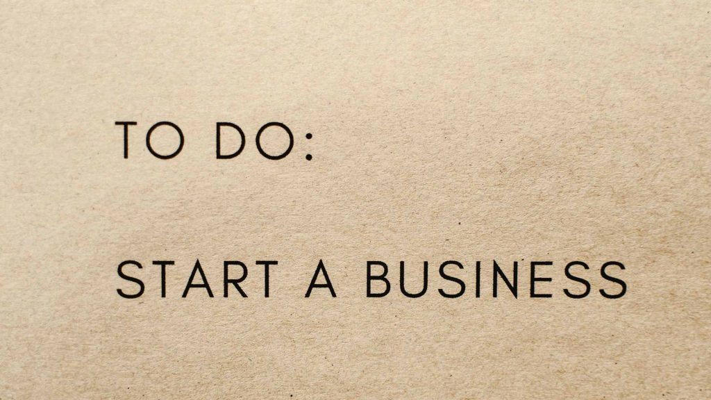 A paper has the following words printed on it: "To Do: Start a Business"